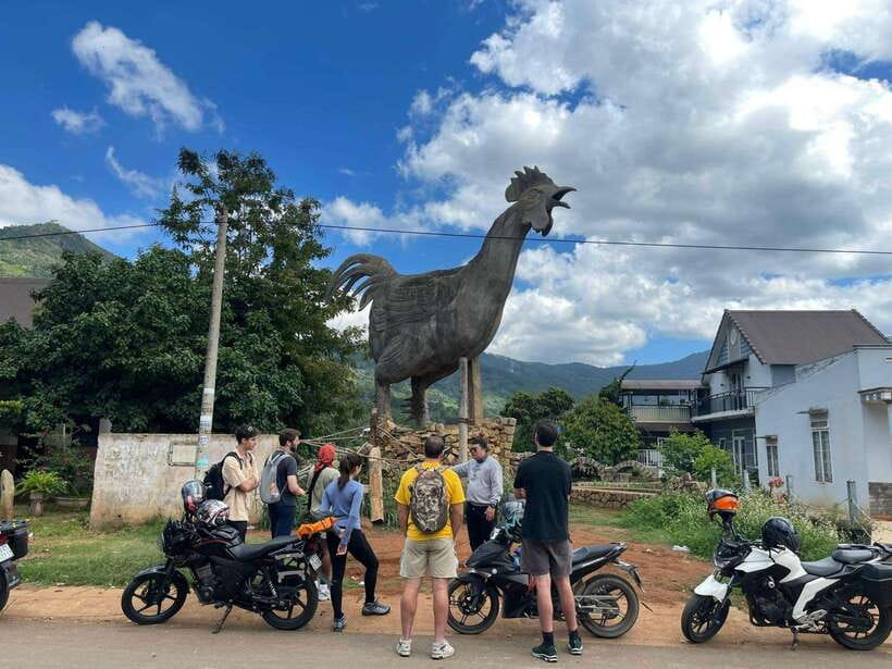 Dalat: MOTORBIKE TOUR TO PONGOUR FALLS- SILK- COFFEE FARM - Chicken Village: a funny final photo with a big sculpture