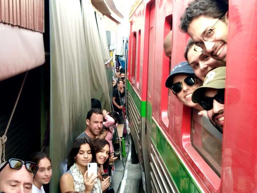 From Bangkok: Floating & Railway Markets Tour & Coconut Farm - Railway Market train ride: the “risky” stall-retract moment