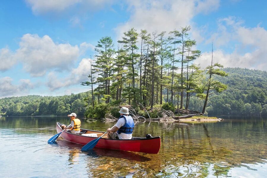 Lapland: Canoeing Trip with Reindeer and Husky Farm Tour - Guided canoeing on a Lapland lake: safe, relaxing, and a nice break from animal time