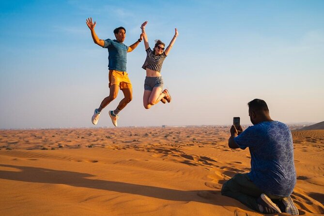 "Morning Desert Safari with Camel Farm visits & Arabic Treats" - Sandboarding on the golden dunes: a quick try that feels like a win